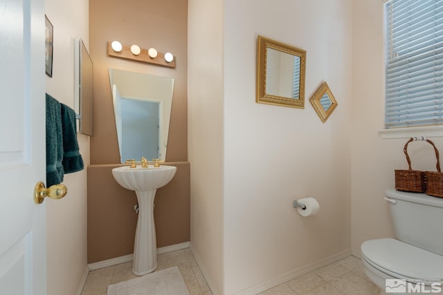 bathroom featuring toilet and tile patterned floors