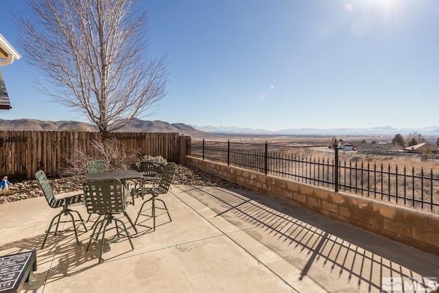 view of patio with a mountain view