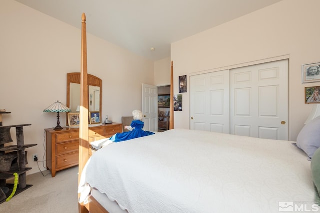 bedroom featuring a closet and light carpet