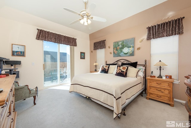 carpeted bedroom featuring ceiling fan and access to outside