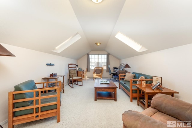 living room with lofted ceiling with skylight and carpet flooring