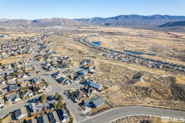 drone / aerial view featuring a mountain view