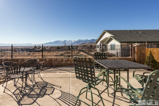 view of patio / terrace with a mountain view