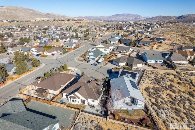 birds eye view of property with a mountain view