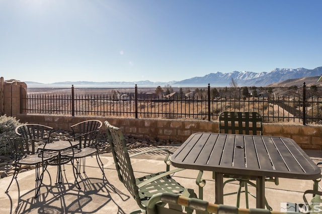 view of patio / terrace with a mountain view