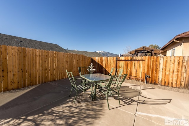 view of patio featuring a mountain view