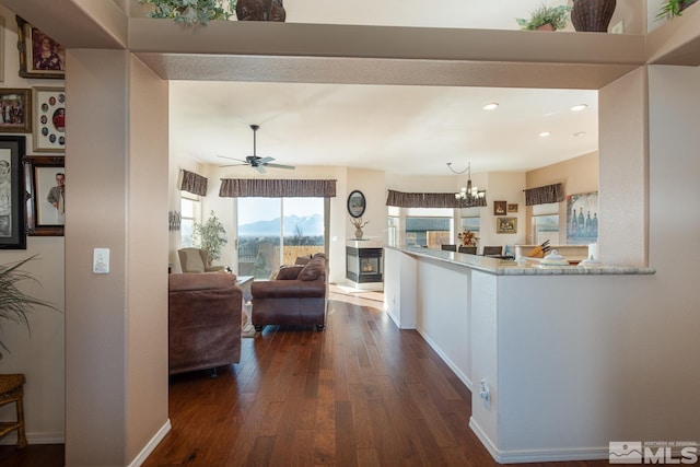 interior space featuring a chandelier and dark hardwood / wood-style floors