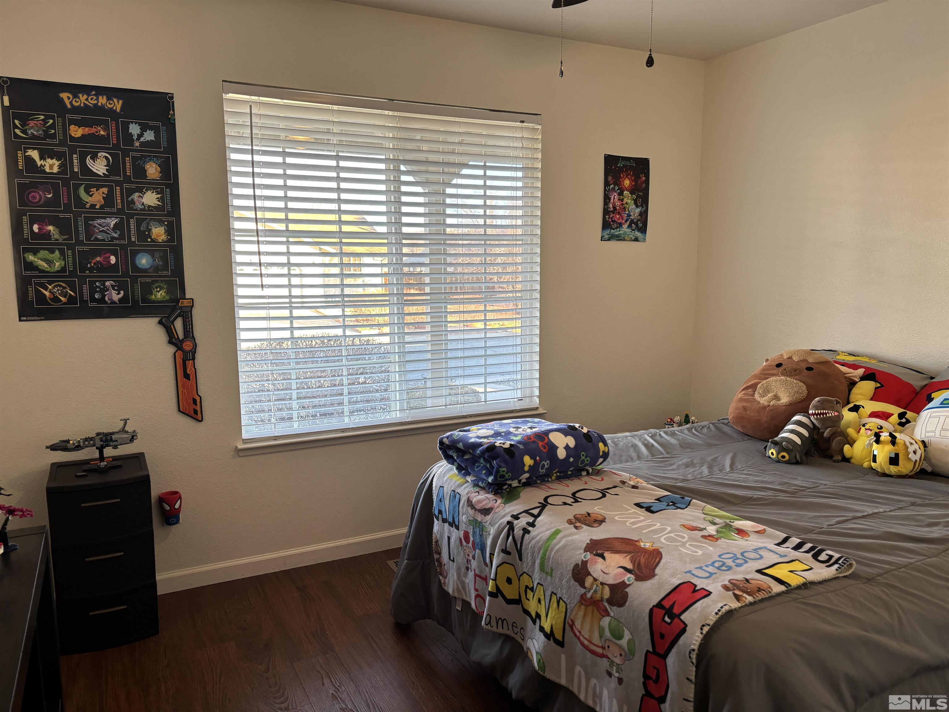 bedroom with dark hardwood / wood-style floors