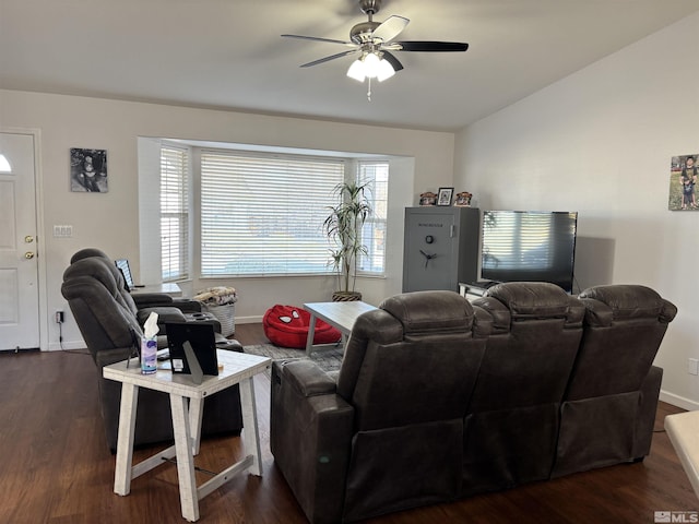 living room with ceiling fan and dark hardwood / wood-style floors