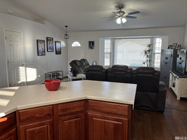 kitchen with ceiling fan, decorative light fixtures, lofted ceiling, and dark hardwood / wood-style floors