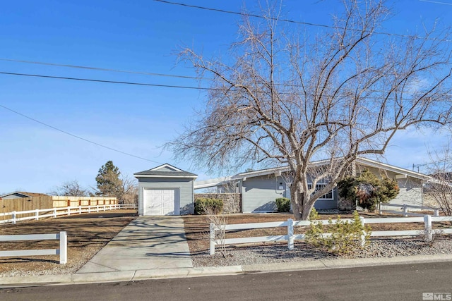 ranch-style house with an outbuilding and a garage