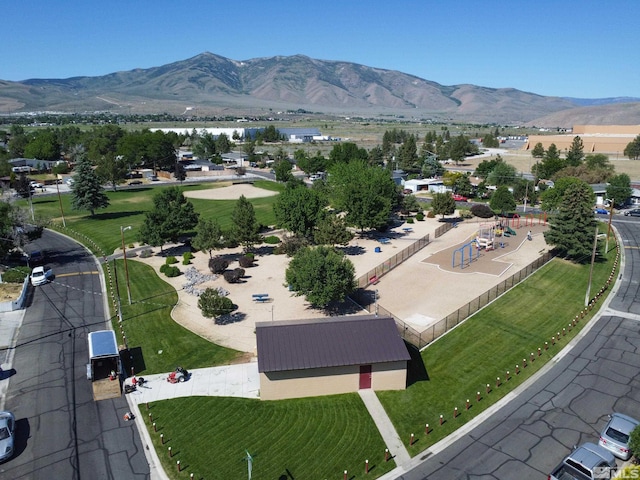 birds eye view of property with a mountain view