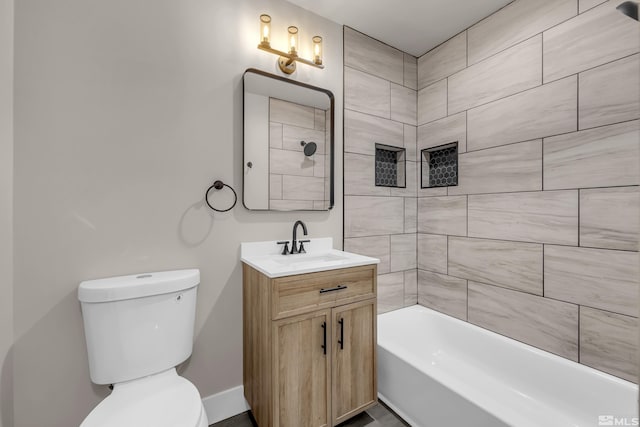 full bathroom featuring toilet, vanity, and tiled shower / bath combo