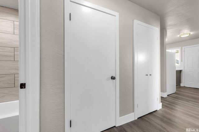 corridor featuring hardwood / wood-style flooring