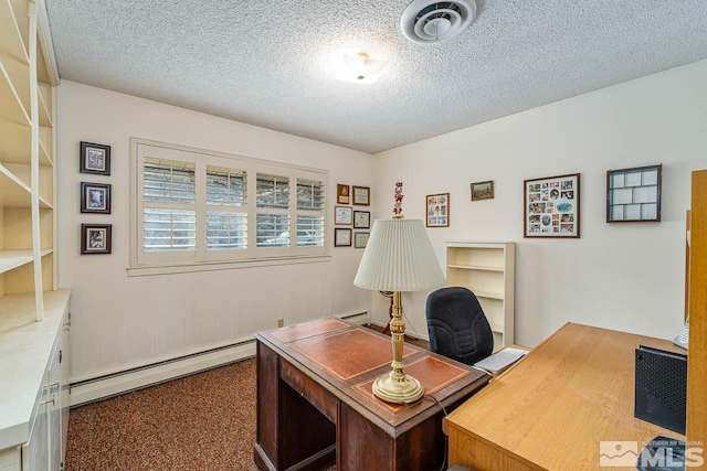 carpeted office with a baseboard heating unit and a textured ceiling