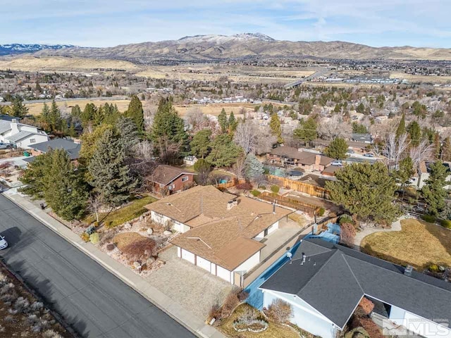 birds eye view of property featuring a mountain view