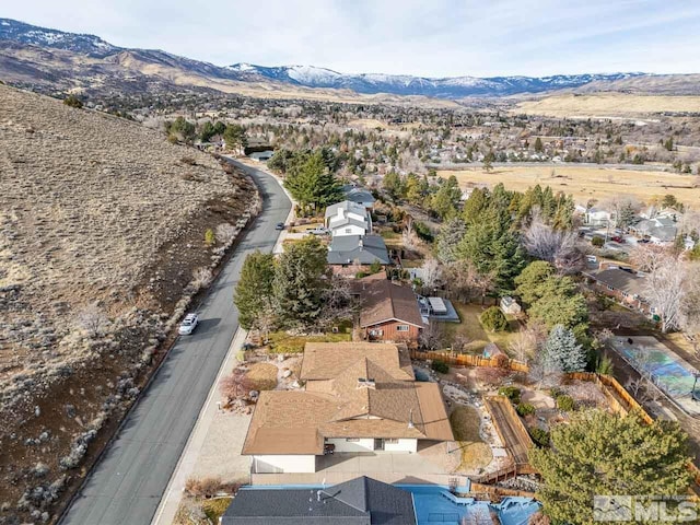 birds eye view of property with a mountain view