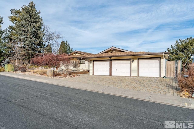 single story home with a garage