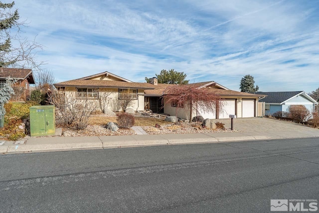 single story home featuring a garage