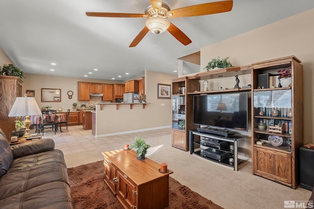 living room with ceiling fan and light tile patterned floors