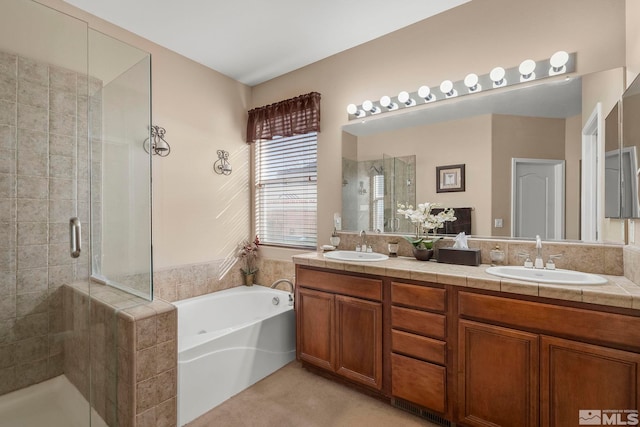 bathroom with plus walk in shower and vanity