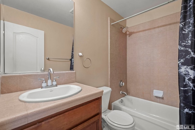 full bathroom with toilet, vanity, and shower / tub combo with curtain