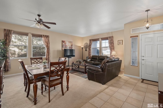 living room with ceiling fan and light tile patterned floors