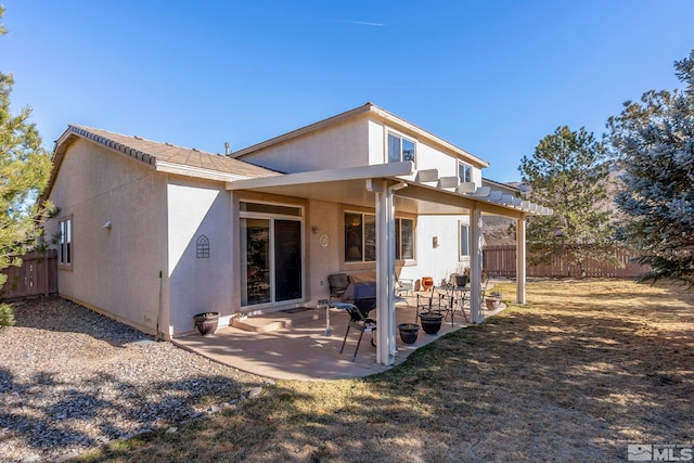 back of property featuring a patio area