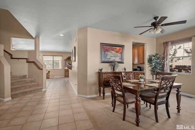 tiled dining room with ceiling fan