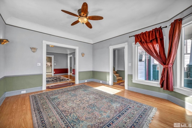 interior space with ceiling fan and light hardwood / wood-style flooring