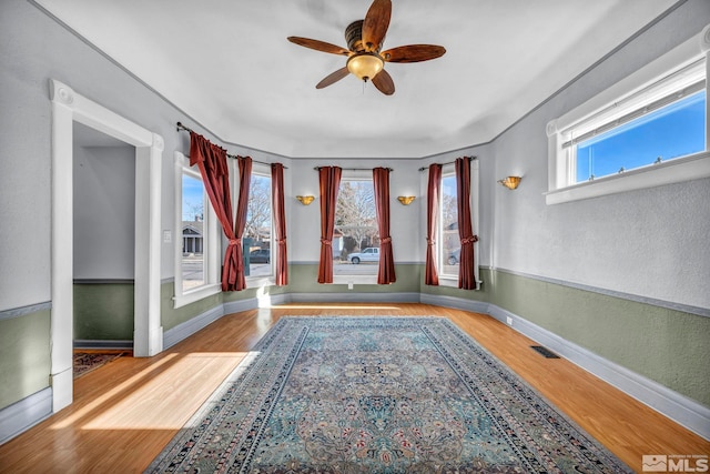 interior space featuring light wood-type flooring and ceiling fan