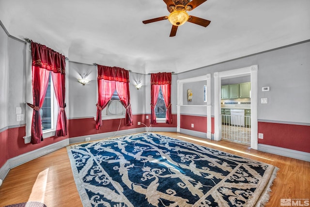 interior space with ceiling fan and hardwood / wood-style floors