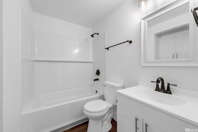 full bathroom featuring toilet, wood-type flooring, vanity, and bathing tub / shower combination