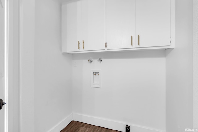 laundry room with washer hookup, cabinets, and dark hardwood / wood-style floors