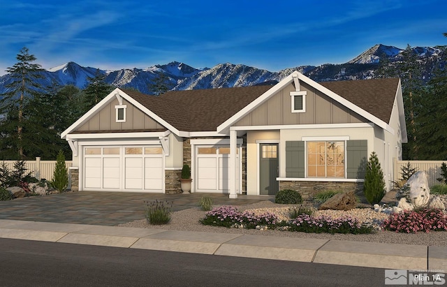 craftsman house with a garage and a mountain view