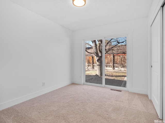 spare room featuring carpet