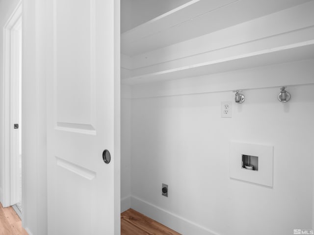 washroom with hardwood / wood-style floors, hookup for a washing machine, and hookup for an electric dryer