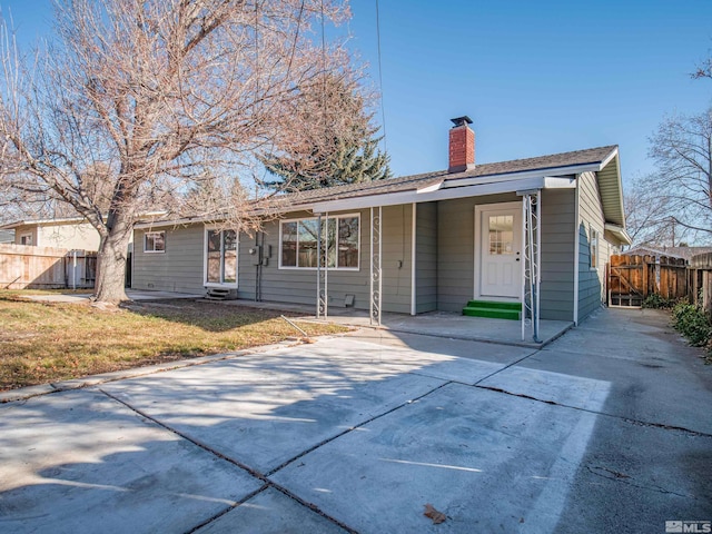 ranch-style home with a front lawn