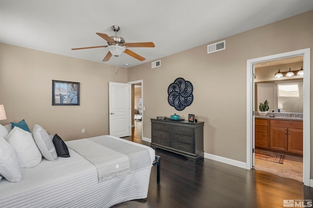 bedroom with connected bathroom, dark hardwood / wood-style flooring, and ceiling fan