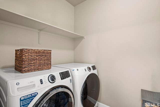 laundry room featuring washing machine and clothes dryer