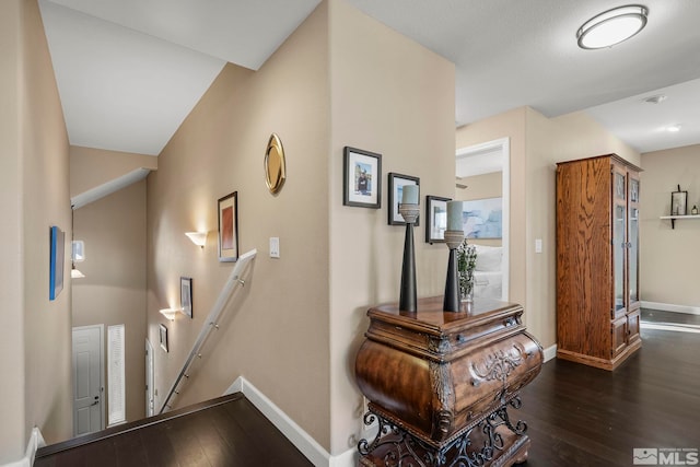 hallway with dark hardwood / wood-style floors