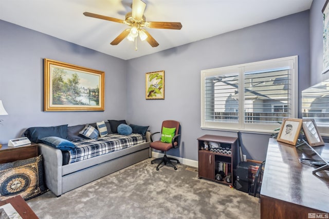 living room with ceiling fan and carpet flooring