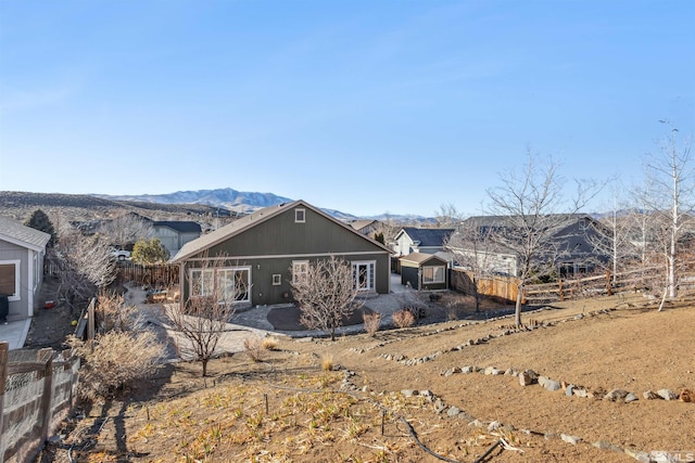 rear view of property with a mountain view