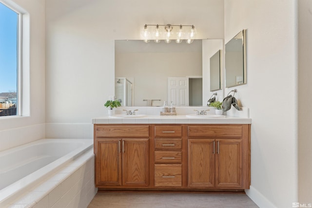 bathroom with vanity, tile patterned floors, and independent shower and bath