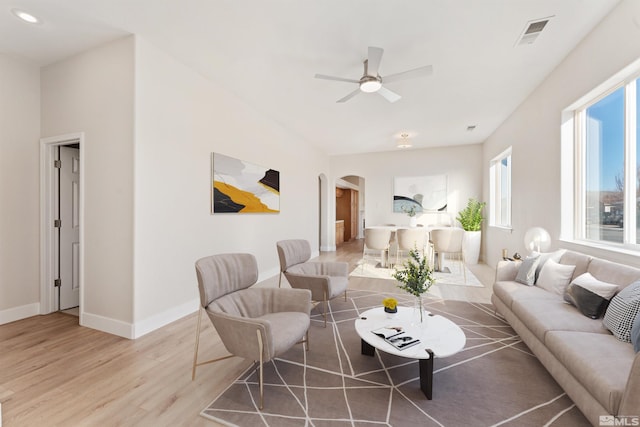 living room with ceiling fan and hardwood / wood-style floors