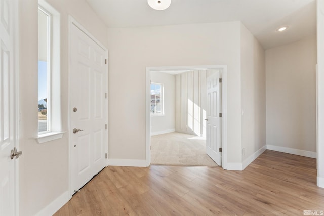 entryway with light hardwood / wood-style floors