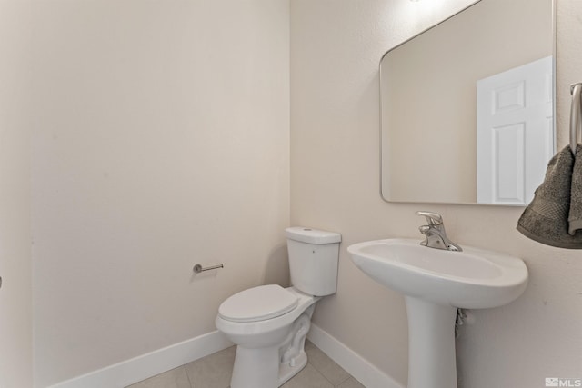 bathroom featuring tile patterned floors and toilet