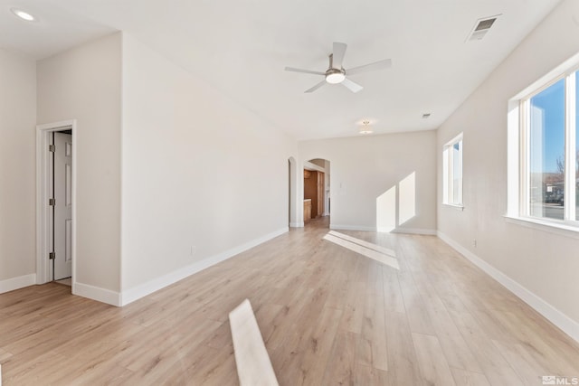 unfurnished living room featuring ceiling fan and light wood-type flooring