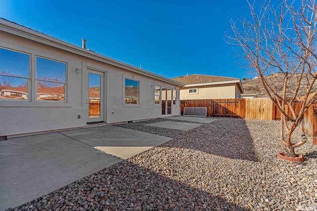 rear view of property featuring a patio