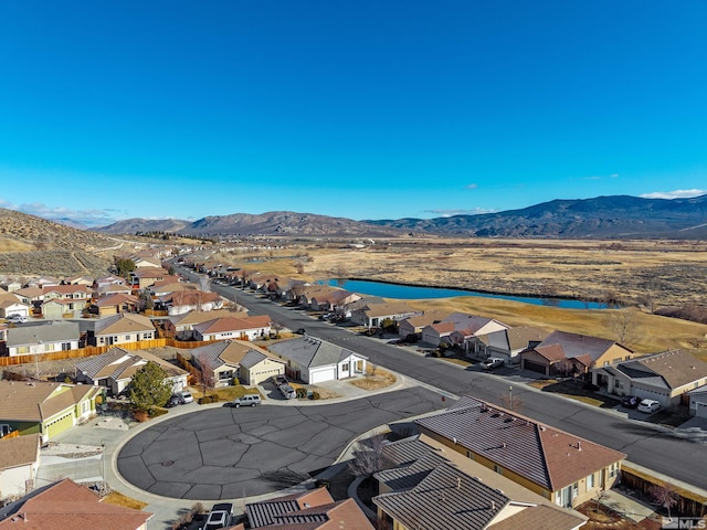 bird's eye view featuring a water and mountain view